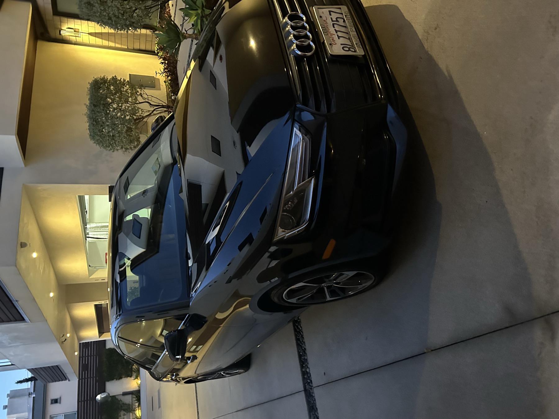 Black Audi with glossy front finish after detailing