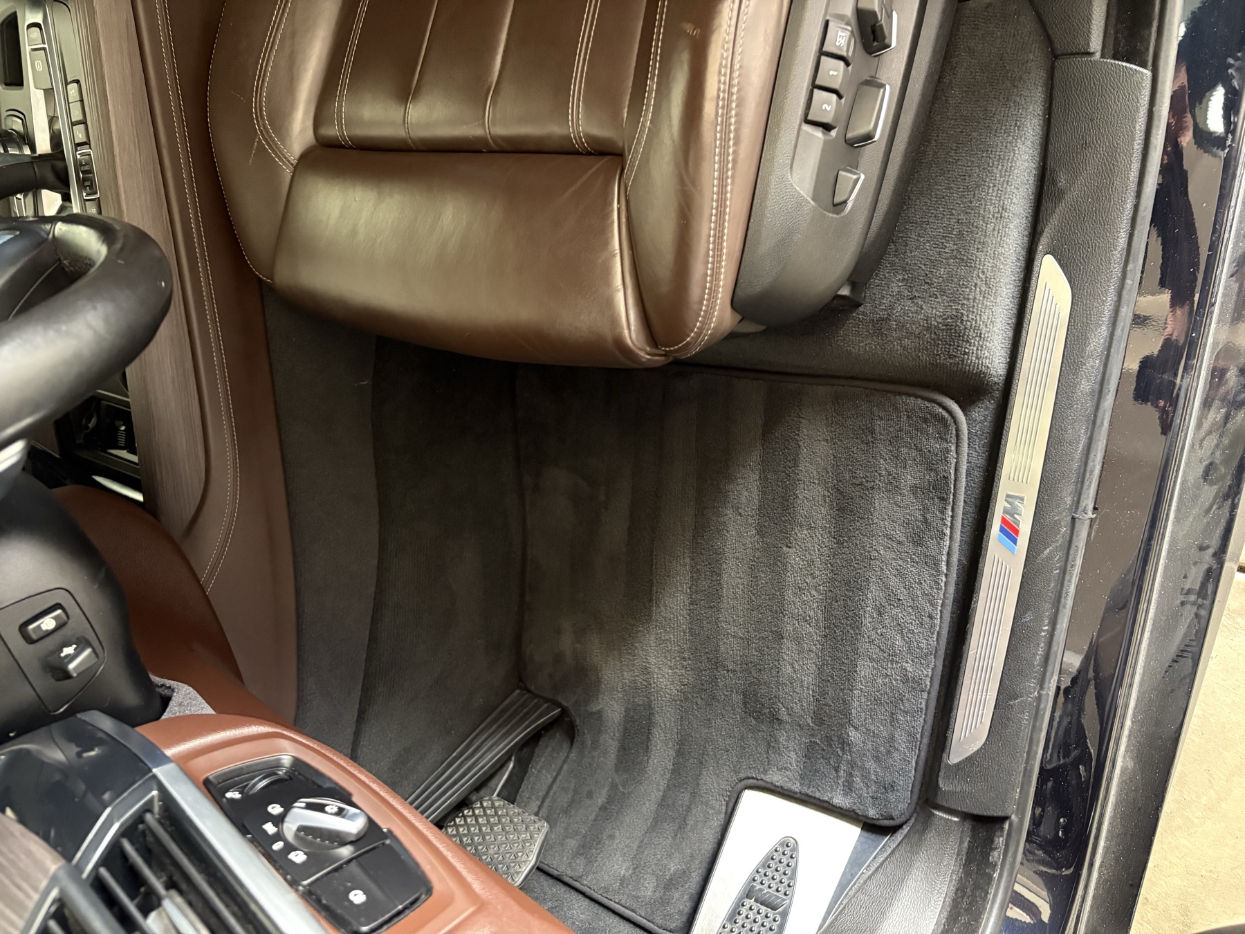 Fresh carpet lines and cleaned leather after an interior detail